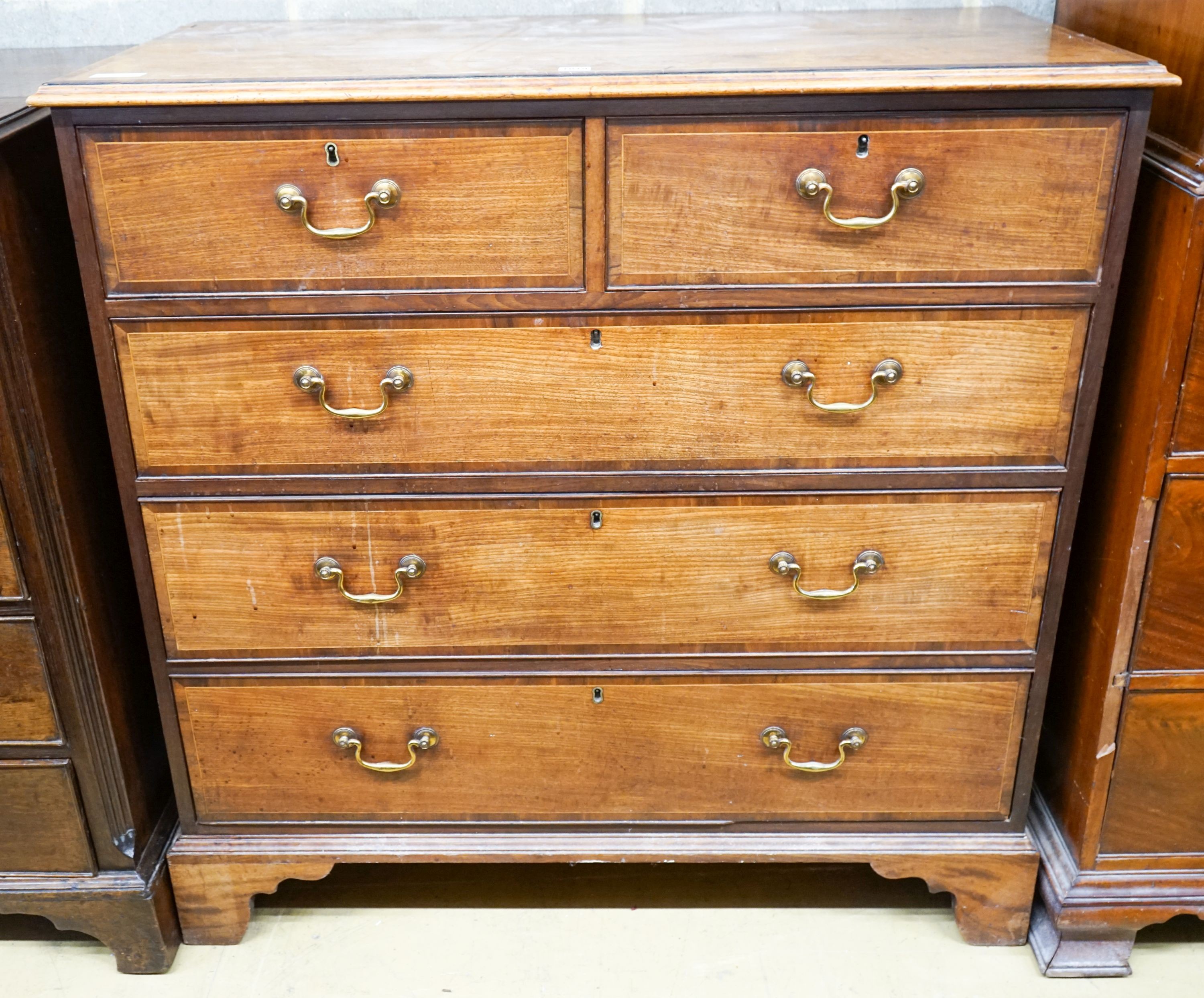 A George III banded mahogany chest, width 110cm, depth 55cm, height 110cm